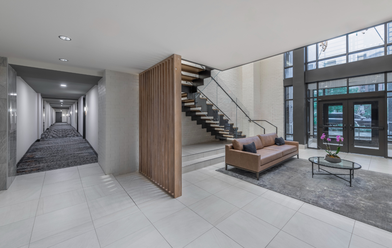 Lobby with staircase and a hallway