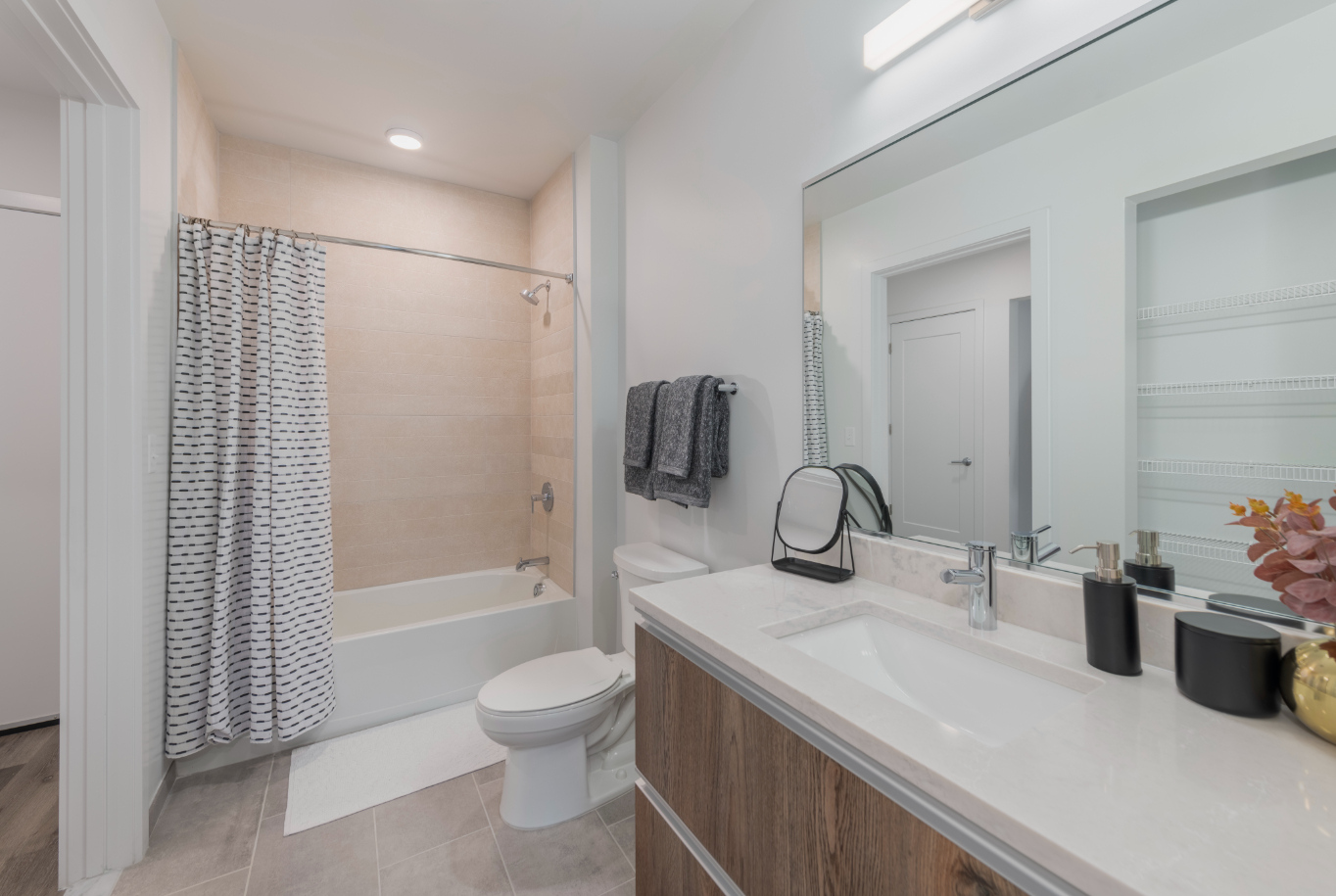 Furnished bathroom with white countertops