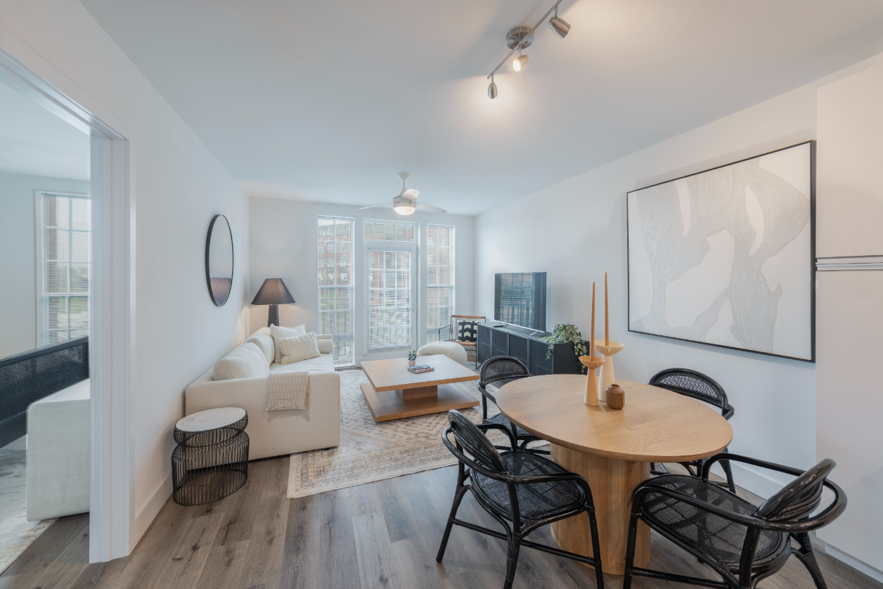 Dining Room with a table and living room with couches